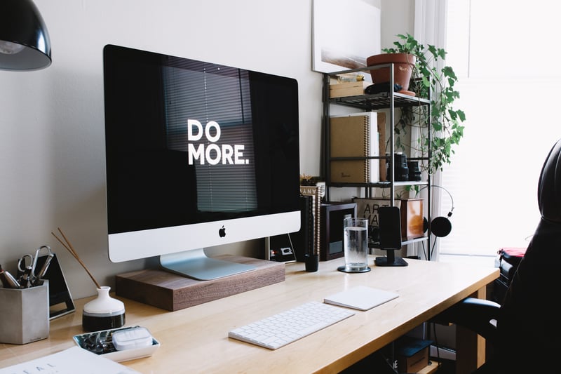 Desk with Mac That Says Do More